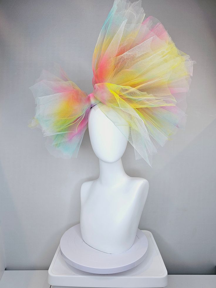 From the 2024 Featured Milliner of the Kentucky Derby Museum  Gorgeous Kentucky Derby hat fascinator  kentucky derby hat fascinator very large netting colorful distressed tulle rainbow sheer asymmetric bow on headband headband attachment.  each hat is totally one of a kind! no two are alike! I can probably add feathers, flowers etc to existing hats for a small fee. I cannot remove anything from existing hats. Just message me and see if we can make it work! :) I cannot make custom order from scra Tulle Hat, Summer Party Headpieces Made Of Tulle, Summer Party Tulle Headpiece, Fun Multicolor Costume Hats And Headpieces, Multicolor Summer Fascinator, Multicolor Party Fascinator Hat, Whimsical Festival Fascinator, Whimsical Multicolor Spring Fascinator, Flower-shaped Fascinator For Kentucky Derby