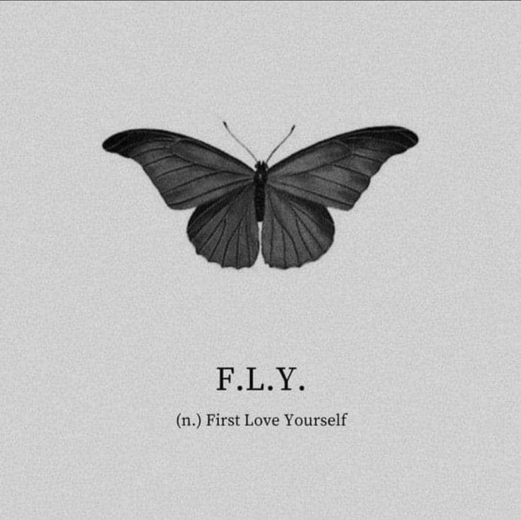 a black and white photo of a butterfly with the words e l y on it