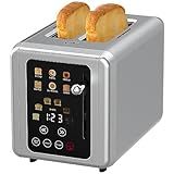 two slices of bread sitting on top of a silver toaster with black dials