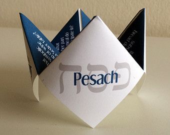 an origami piece with the word pesach printed on it