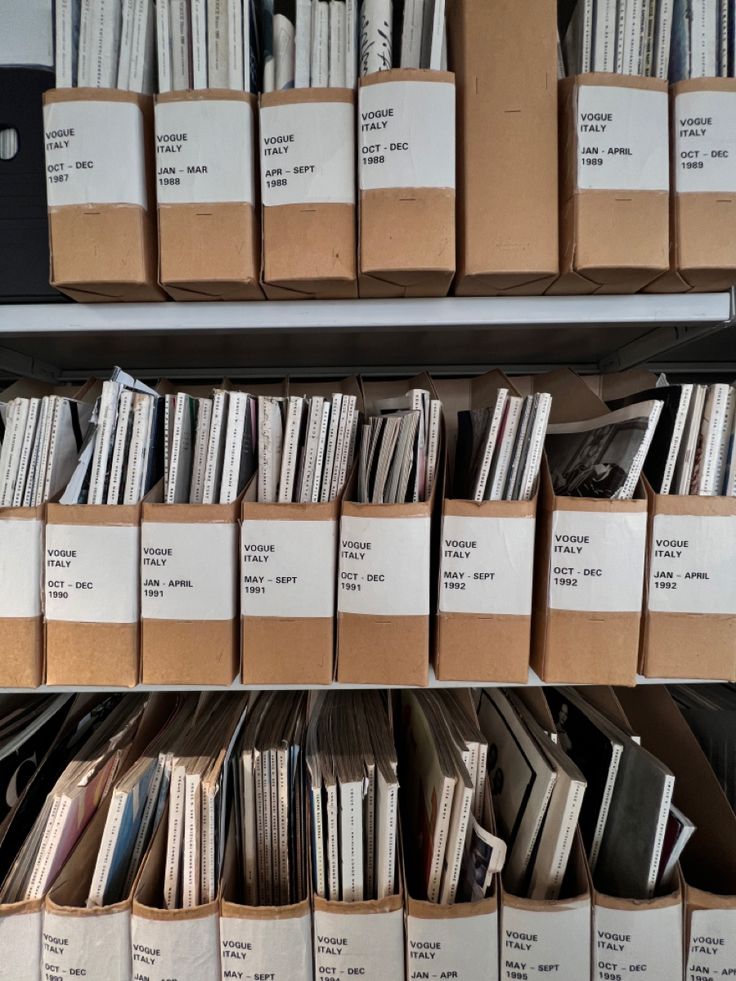 several stacks of records are stacked on top of each other in the same bins