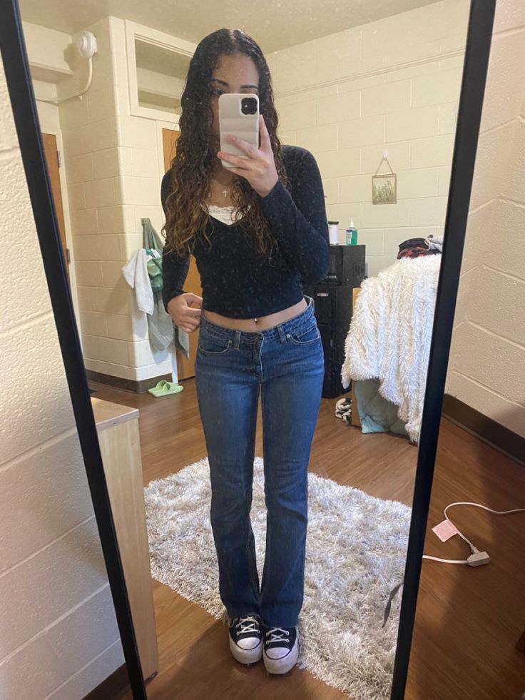 girl posing in the mirror wearing a black long sleeve crop top and boot cut jeans with platform black converse Basic Black Jeans Outfit, Low Bootcut Jeans Outfit, Outfits With Bootcut Jeans For School, Low Rise Jeans Outfit School, Bootcut Jeans And Tank Top Outfit, Bootcut Jeans And Converse Outfit, Lose Rise Jeans Outfit, Blue Bootcut Jeans Outfit, Bootcut Jeans Outfit Teens