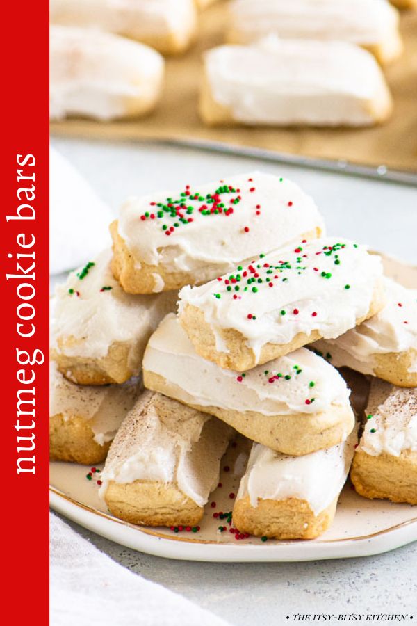 a plate full of cookies with white frosting and sprinkles on them