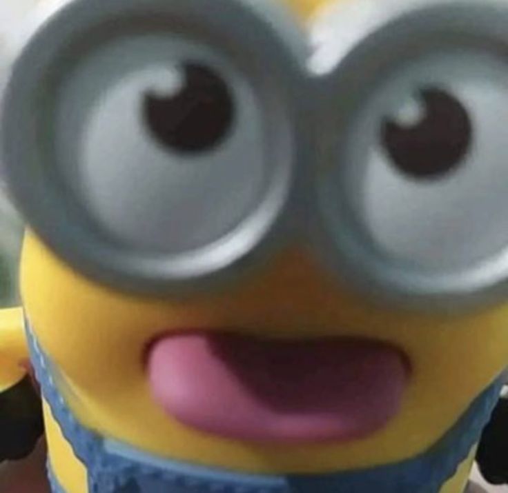 a close up of a minion with big eyes