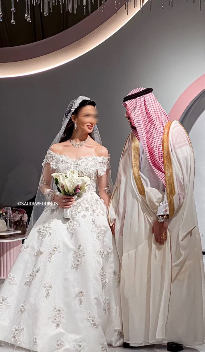 the bride and groom are dressed in traditional arabic garb for their wedding day ceremony