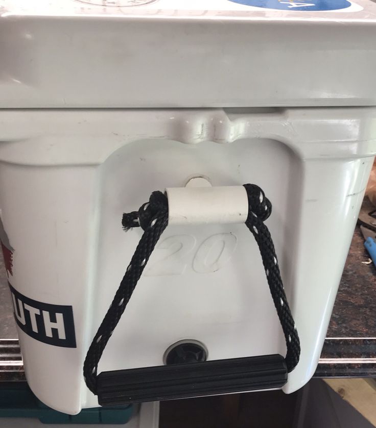 a white cooler sitting on top of a counter