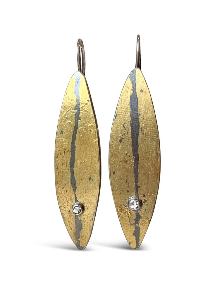 Gold & Silver Earrings - An easy, everyday earring when you want a bit of a modern edge, these earrings are fabricated using fused 24k gold on sterling silver and each display a 2mm white topaz. Sterling silver hooks with clasp. Contemporary Yellow Gold Sterling Silver Earrings, Modern Gold Teardrop Diamond Earrings, Contemporary Sterling Silver Earrings In Yellow Gold, Contemporary Sterling Silver Yellow Gold Earrings, Oval Gold Diamond Earrings In Sterling Silver, Gold Oval Diamond Earrings In Sterling Silver, Modern Gold Diamond Pierced Earrings, Modern Gold Diamond Earrings In Sterling Silver, Contemporary Gold Hammered Earrings