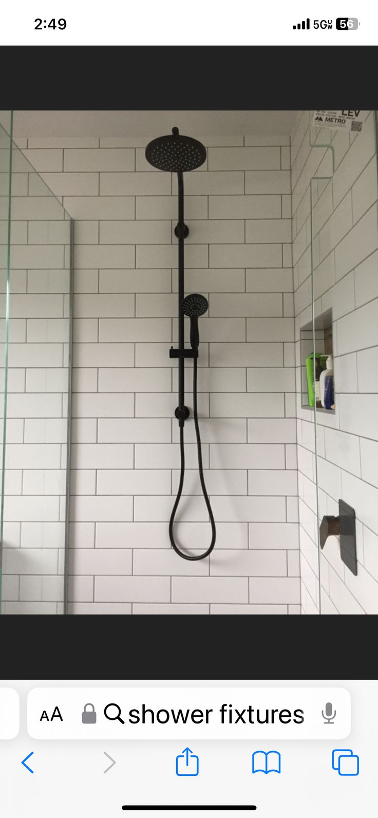 an image of a shower head and hand held shower faucet in the bathroom