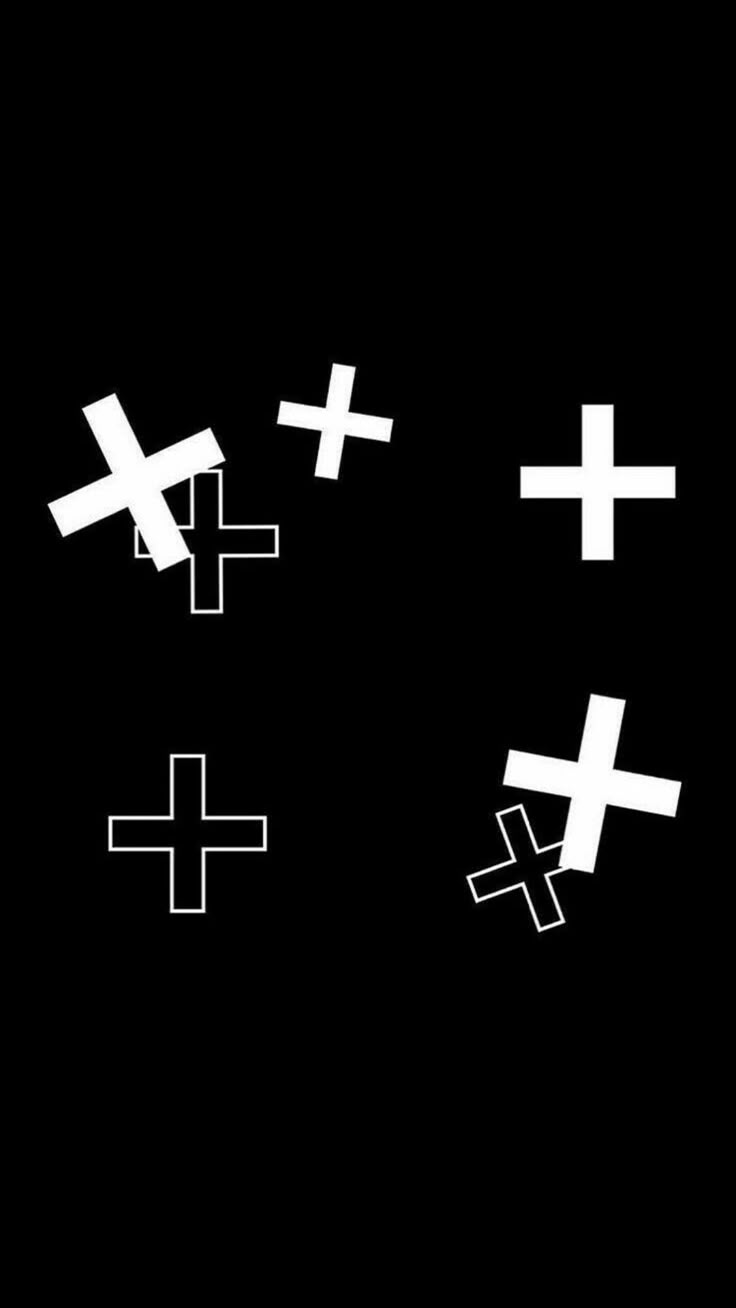 four crosses are drawn in white on a black background, each with different sizes and shapes