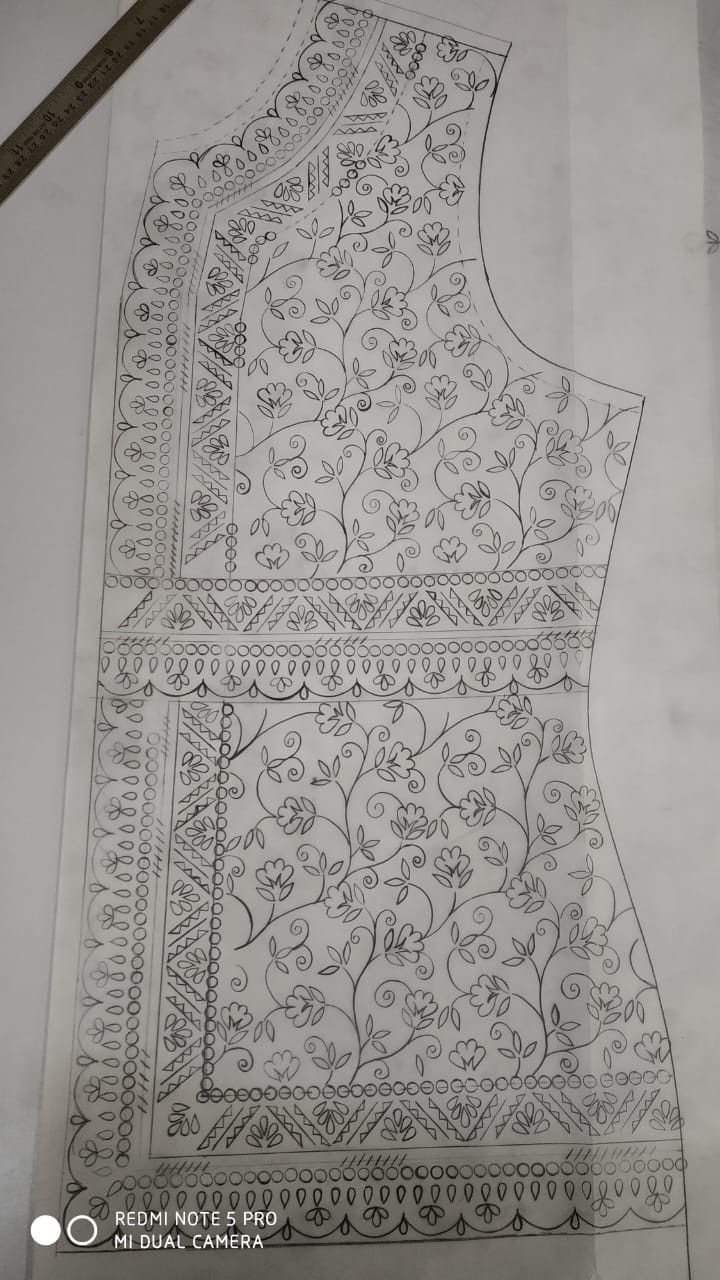 a drawing of a dress with floral designs on the front and back, in white paper