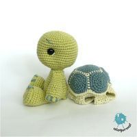 a crocheted stuffed animal next to a small turtle