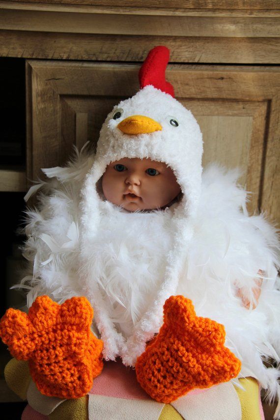 a baby dressed in a chicken costume