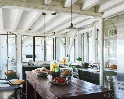 the kitchen is clean and ready to be used for breakfast or dinner time, as well as fresh fruit on the counter