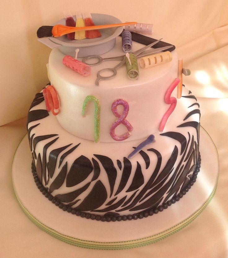 a decorated birthday cake with scissors and other items