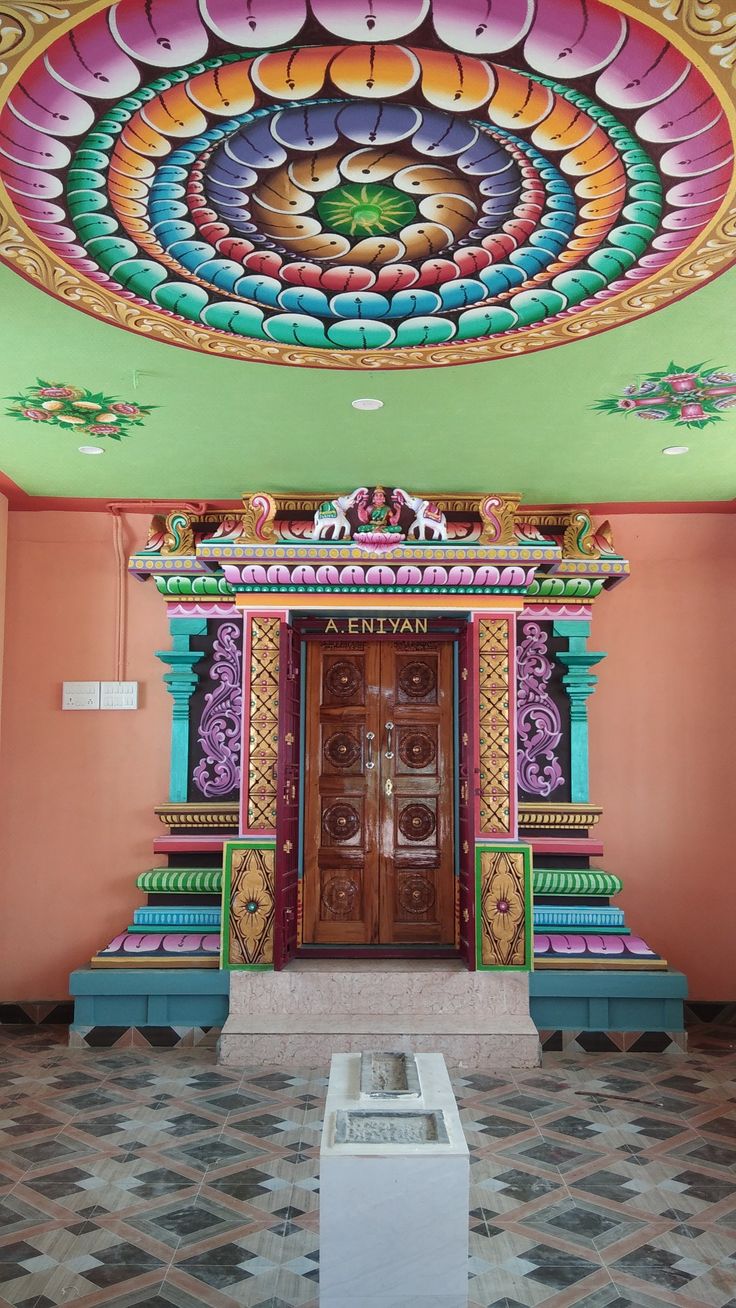 an elaborately decorated entrance to a brightly colored building