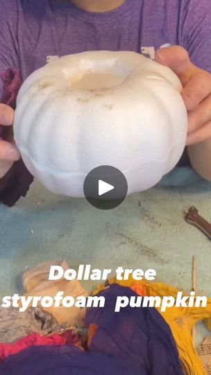 a person is holding a white pumpkin in front of other items on the ground with text that reads dollar tree styrofoam pumpkin