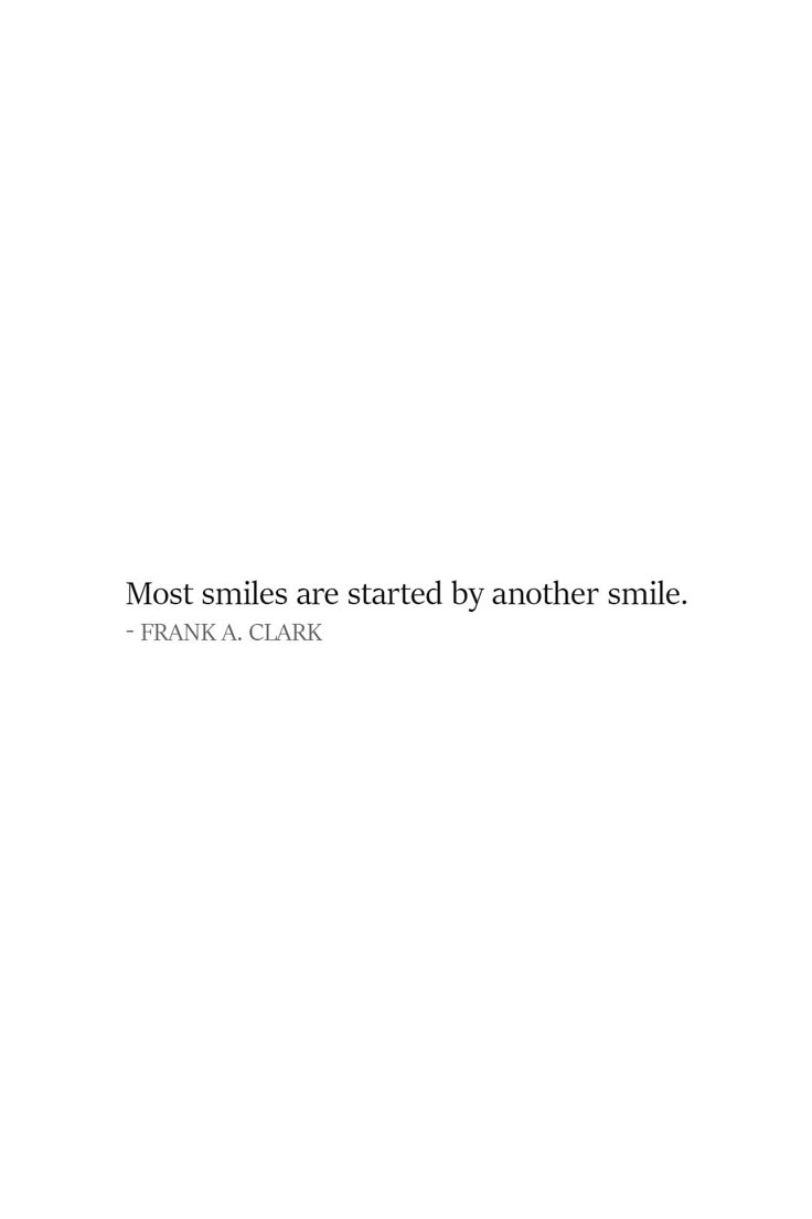 a white wall with a quote on it that says most smiles are started by another smile