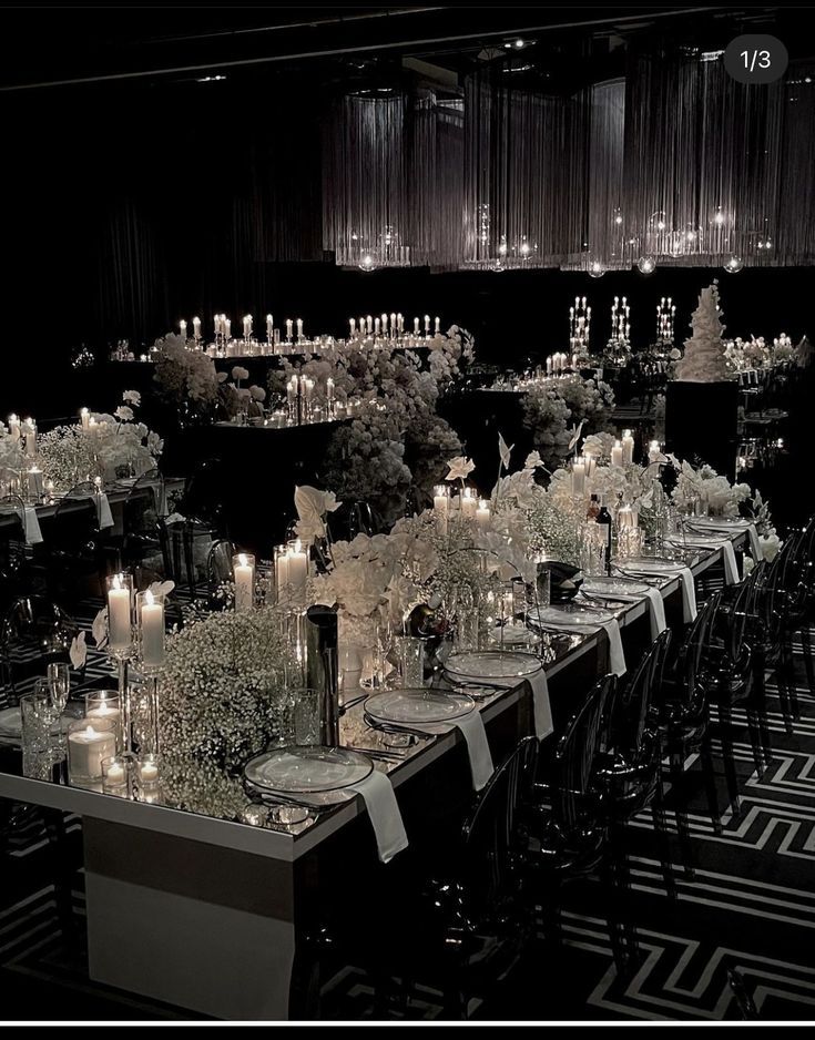 a long table is set with candles and flowers