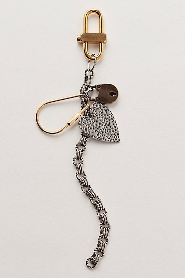 a keychain with a metal hook attached to it's side and a chain hanging from the end