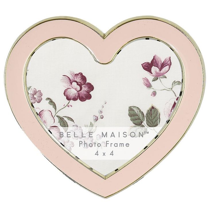 a pink and white heart shaped photo frame