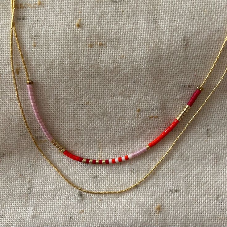 Nwt Gold Beaded And Chain Layered Necklace. White, Bright And Deep Red, Pink And Gold Beads. Lobster Claw Clasp. Perfect Condition, Never Worn. Layer Beaded Necklaces, Teardrop Bead Necklace, Layered Seed Bead Necklace, Beaded Necklace Boho, Red Beaded Necklaces For Summer, Pink Dainty Necklace With Beaded Chain, Pink Necklaces With Delicate Adjustable Chain, Adjustable Pink Necklace With Delicate Chain, Pink Necklace With Delicate Adjustable Chain