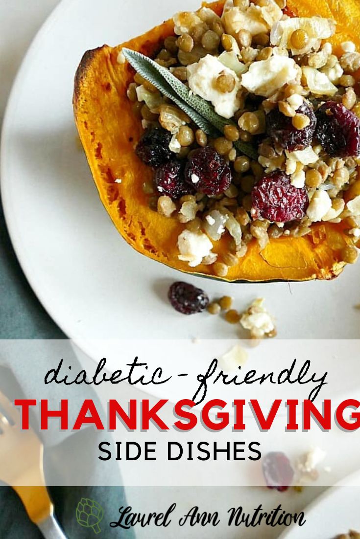 a white plate topped with a stuffed sweet potato filled with nuts and cranberries