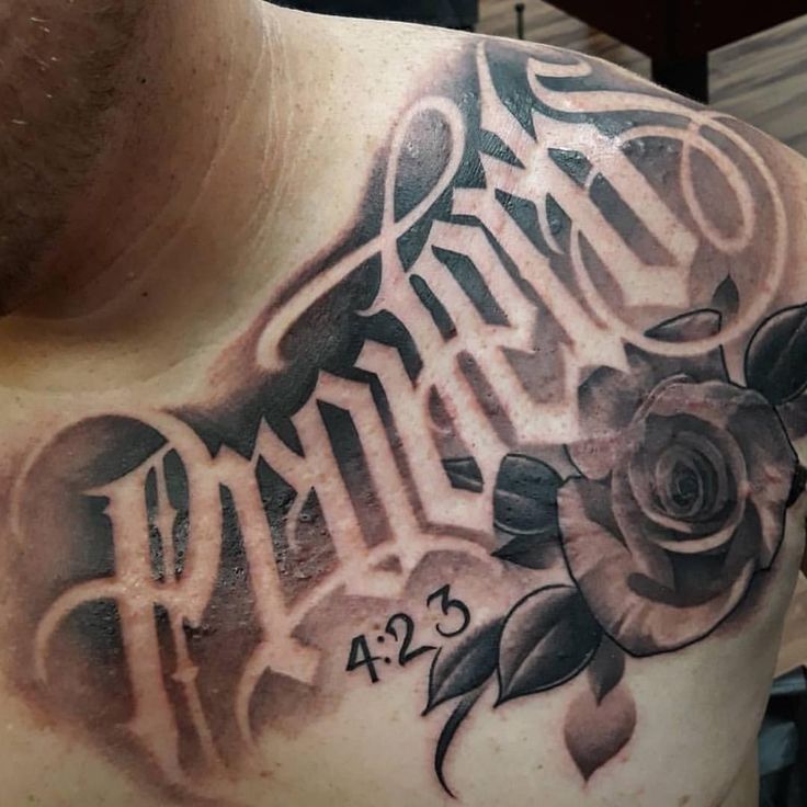 a man with a rose tattoo on his chest