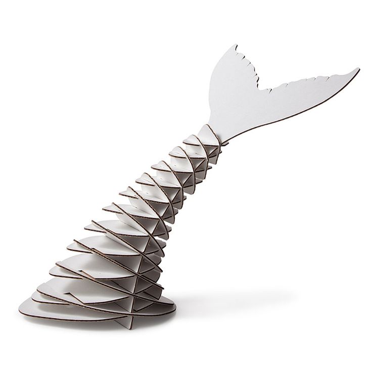 a knife shaped like a whale tail on a white background