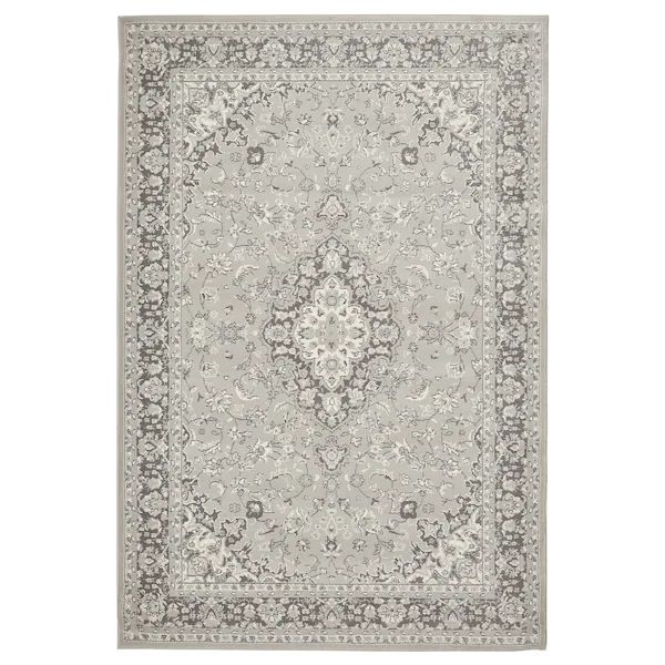 a gray rug with an ornate design on the top and bottom, in grey tones