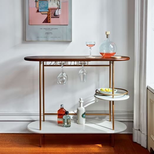 a bar cart with drinks on it in a room