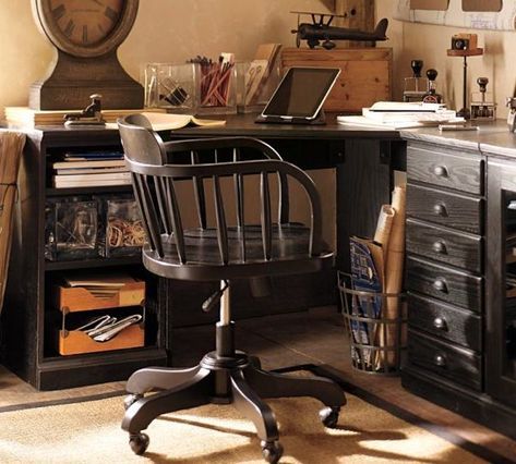 a desk with a chair and a clock on the wall