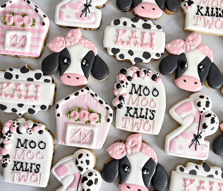 decorated cookies are arranged in the shape of farm animals