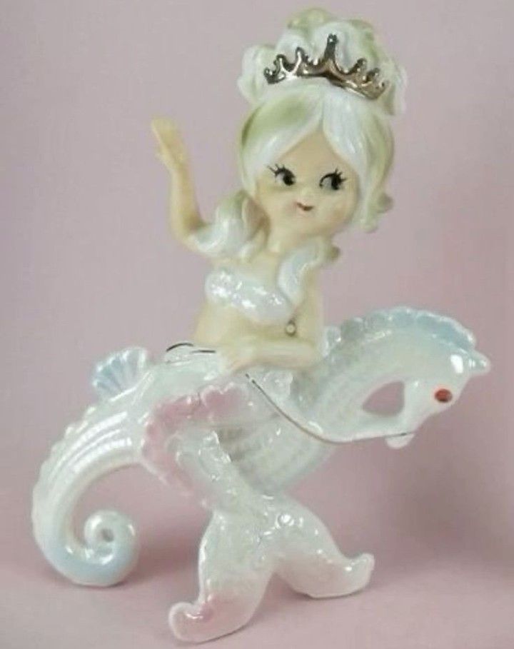 a little figurine with a tiara on top of it