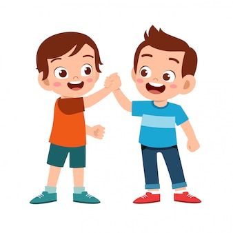 two boys giving each other a high five