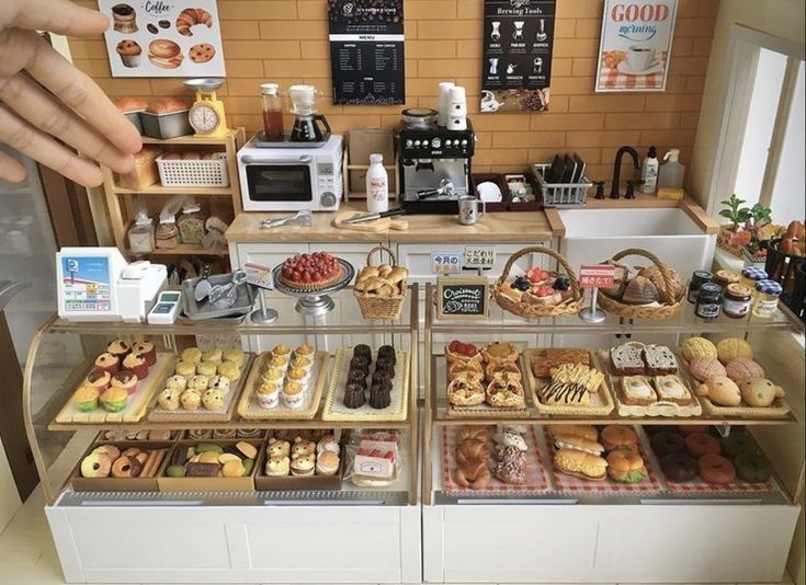 a display case filled with lots of different types of doughnuts and pastries