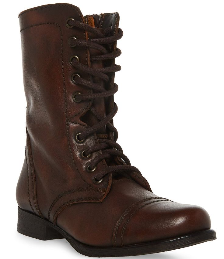 From Steve Madden&#x2C; the Troopa Combat Boots feature:leather upperinside zipper and lace-up frontstitching detailsynthetic outsoleapprox. 7.5" shaft heightapprox. 11.5" shaft circumferenceapprox. 1" heelImported. Steve Madden Combat Boots, Vintage Leather Boots, Combat Clothes, Brown Combat Boots, Ren Fair, Leather Combat Boots, Material Things, Military Inspired, Flat Boots