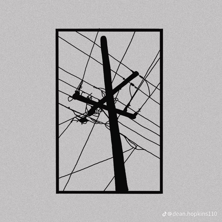 an electric pole and power lines against a gray sky with a square frame in the middle