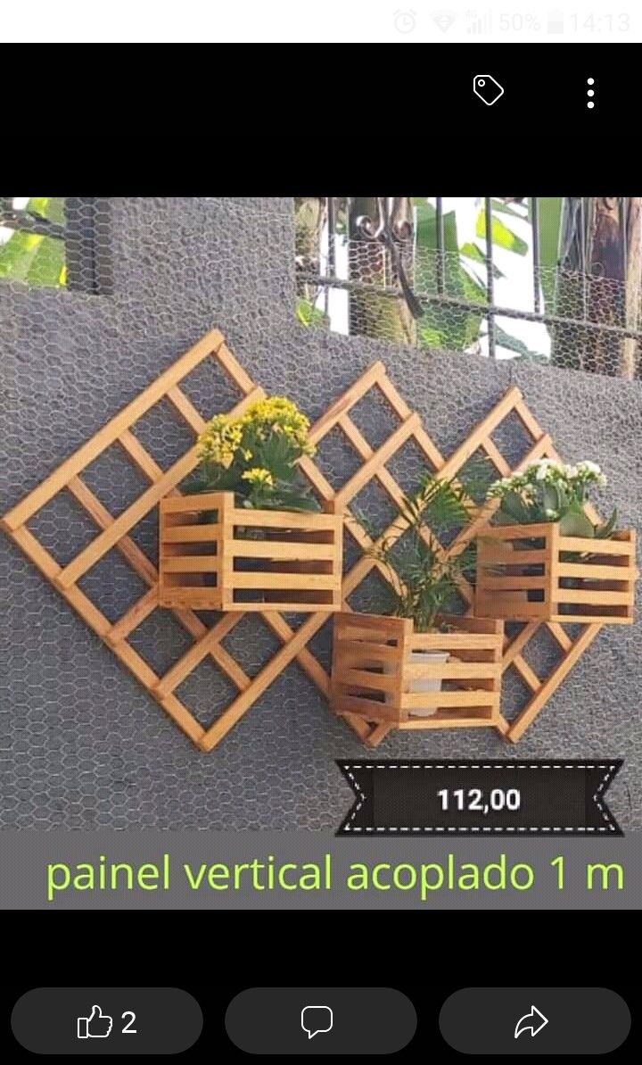 a wooden planter with flowers in it on the wall next to a sign that says panel vertical acoplado 1 m