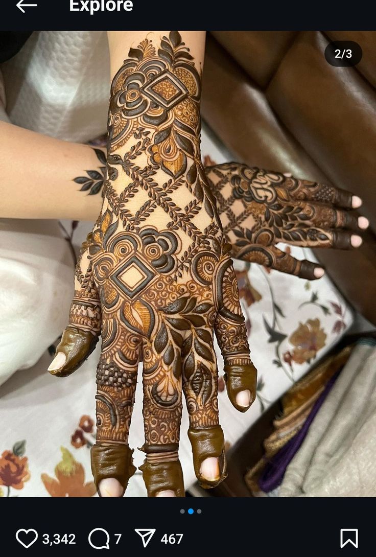 someone is showing off their henna on their hand