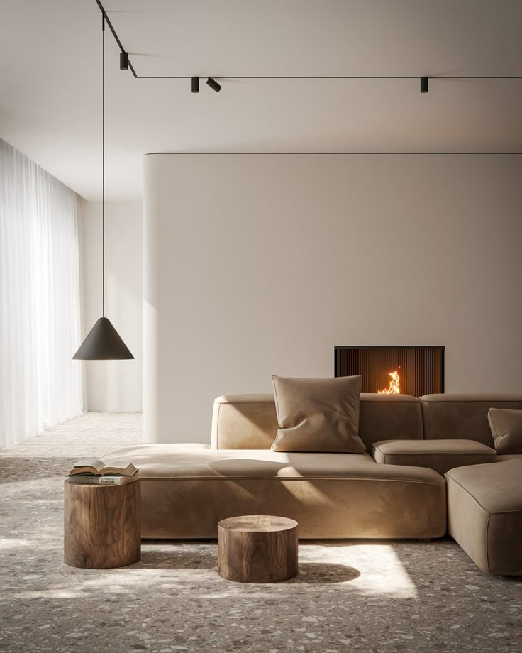 a living room filled with furniture and a fire place in the middle of the room