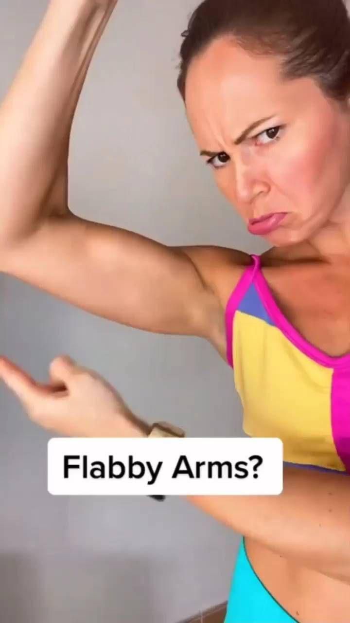 a woman is showing off her muscles with the caption'flap arms? '