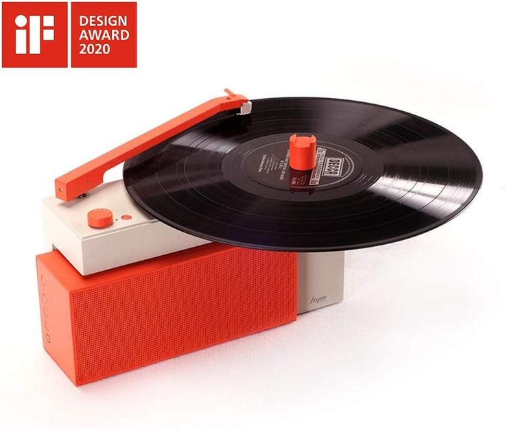 a record player sitting on top of a red box