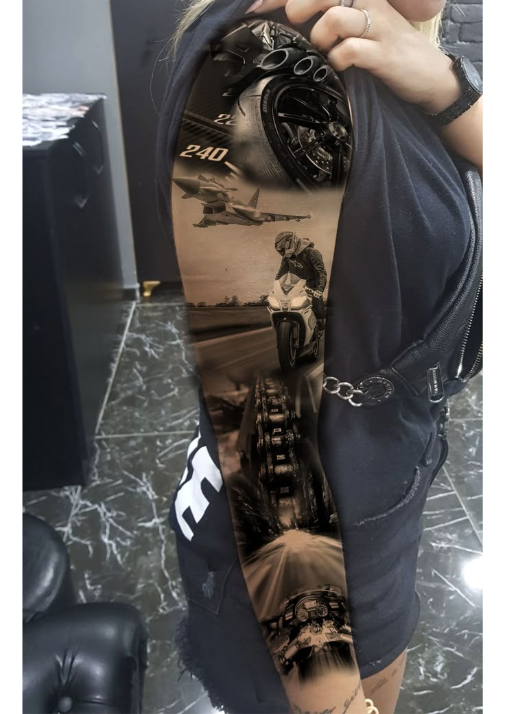 a woman with tattoos on her arm holding up a shirt that has images of people riding motorcycles