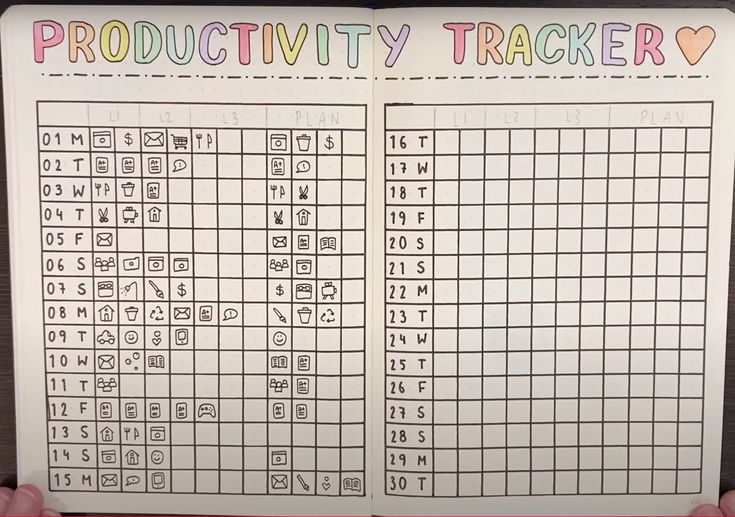 a hand holding an activity book with numbers and symbols