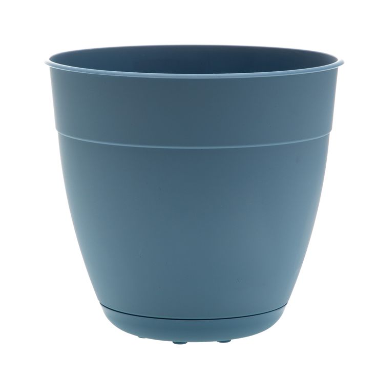 a large blue pot sitting on top of a white table