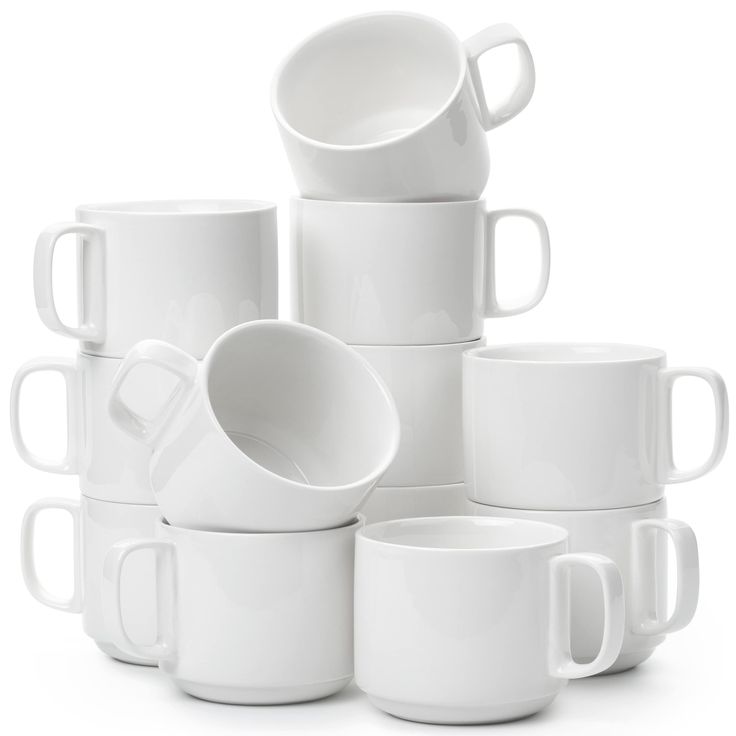 a stack of white coffee mugs sitting next to each other on a white surface