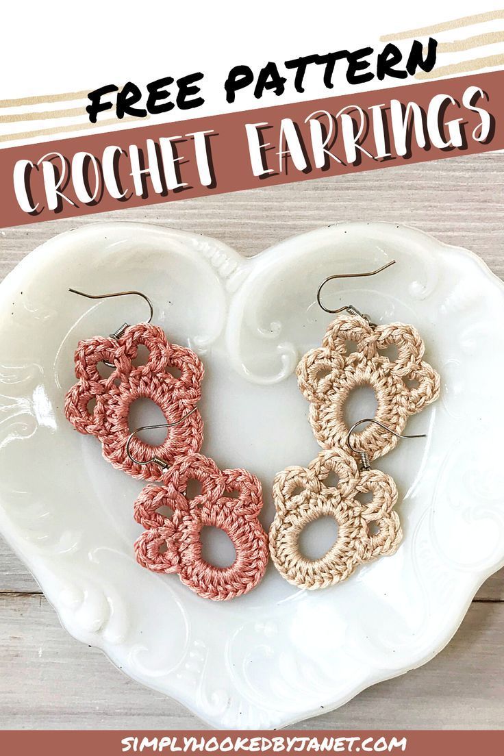 two crochet earrings sitting on top of a heart shaped plate with the words free pattern