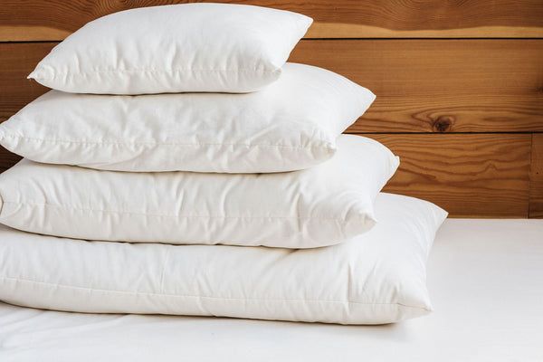 four pillows stacked on top of each other