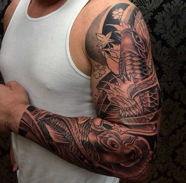 a man with a dragon tattoo on his arm