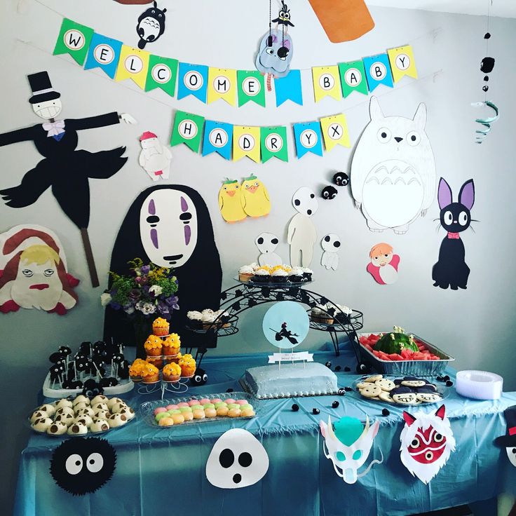 a table topped with lots of food and decorations